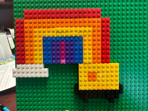 Rainbow with cloud and pot of gold made out of Lego